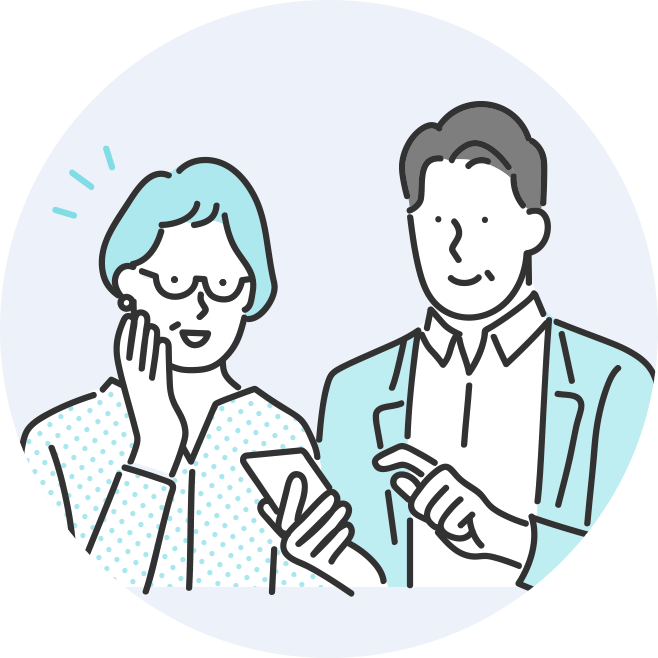 スマートフォンを操作する夫婦